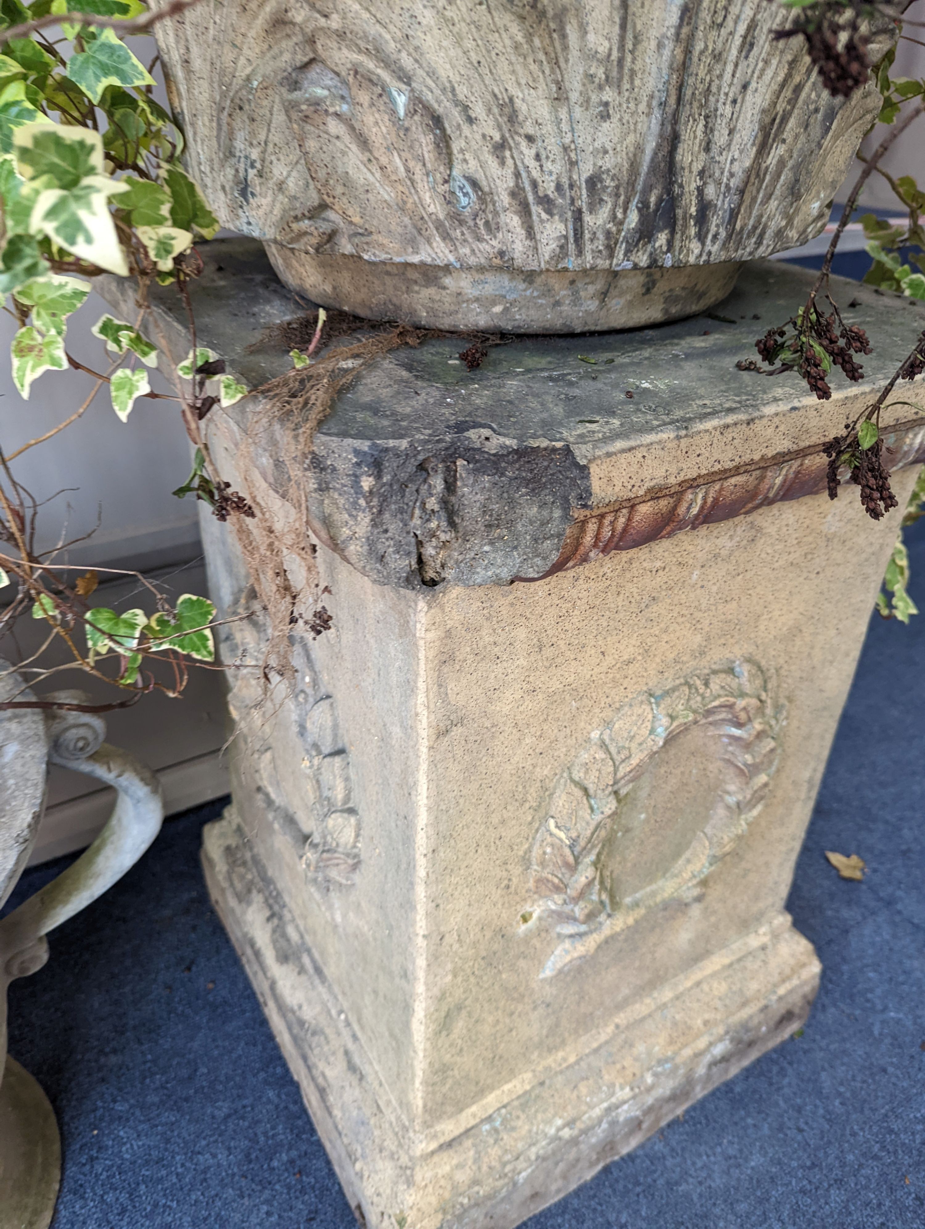 A pair of Victorian earthenware circular garden urns square plinth bases, diameter 58cm, height 96cm